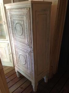 Primitive-style cabinet made from repurposed materials