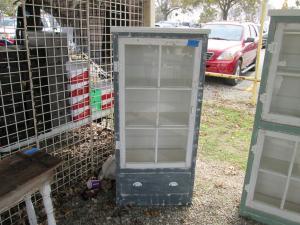 Primitive-style cabinet made from repurposed materials
