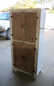 Primitive-style cabinet made from repurposed materials