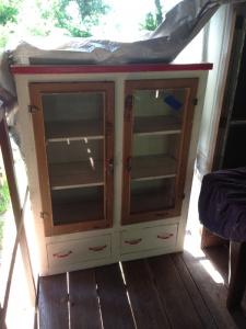 Primitive-style cabinet made from repurposed materials