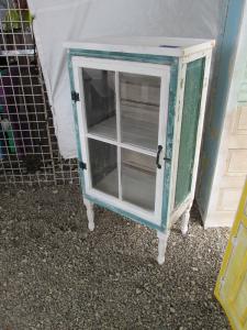 Primitive-style cabinet made from repurposed materials