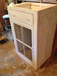 Primitive-style cabinet made from repurposed materials