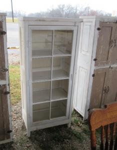 Primitive-style cabinet made from repurposed materials