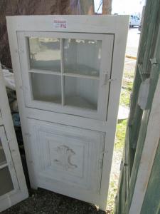 Primitive-style cabinet made from repurposed materials