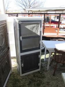 Primitive-style cabinet made from repurposed materials