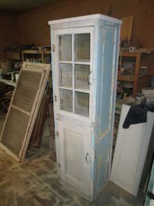 Primitive-style cabinet made from repurposed materials
