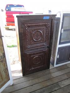 Primitive-style cabinet made from repurposed materials