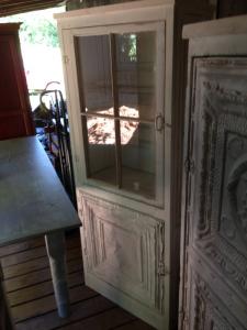 Primitive-style cabinet made from repurposed materials