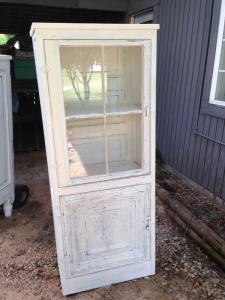 Primitive-style cabinet made from repurposed materials