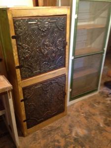 Primitive-style cabinet made from repurposed materials
