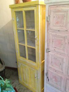 Primitive-style cabinet made from repurposed materials