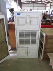 Primitive-style cabinet made from repurposed materials