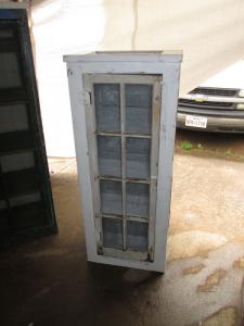 Primitive-style cabinet made from repurposed materials