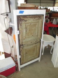Primitive-style cabinet made from repurposed materials