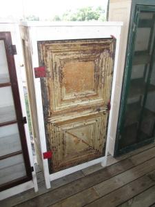 Primitive-style cabinet made from repurposed materials