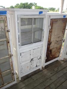 Primitive-style cabinet made from repurposed materials