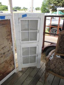 Primitive-style cabinet made from repurposed materials