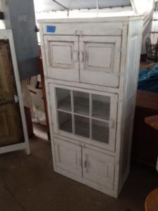 Primitive-style cabinet made from repurposed materials