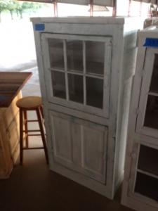 Primitive-style cabinet made from repurposed materials