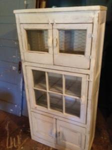 Primitive-style cabinet made from repurposed materials