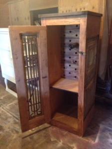 Primitive-style wine cabinet made from repurposed materials