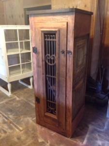 Primitive-style wine cabinet made from repurposed materials