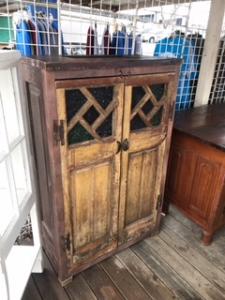 Primitive-style wine cabinet made from repurposed materials