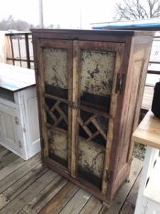 Primitive-style wine cabinet made from repurposed materials