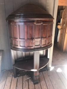 Primitive-style wine cabinet made from repurposed materials