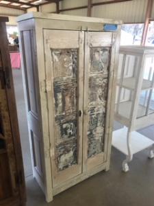 Primitive-style wine cabinet made from repurposed materials