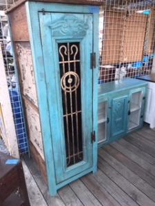 Primitive-style wine cabinet made from repurposed materials