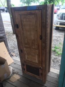 Primitive-style wine cabinet made from repurposed materials