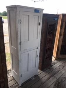Primitive-style cabinet made from repurposed materials