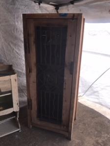 Primitive-style wine cabinet made from repurposed materials