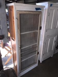 Primitive-style wine cabinet made from repurposed materials