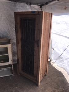 Primitive-style wine cabinet made from repurposed materials
