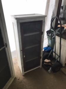 Primitive-style cabinet made from repurposed materials