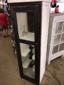 Primitive-style wine cabinet made from repurposed materials