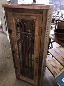 Primitive-style wine cabinet made from repurposed materials