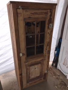 Primitive-style wine cabinet made from repurposed materials