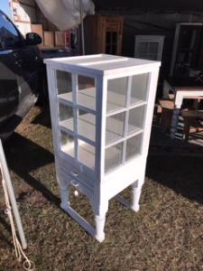Primitive-style cabinet made from repurposed materials