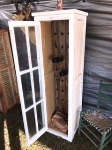 Primitive-style wine cabinet made from repurposed materials