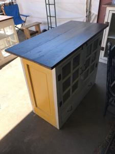 Primitive-style cabinet made from repurposed materials