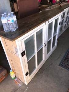 Primitive-style cabinet made from repurposed materials