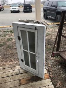 Primitive-style cabinet made from repurposed materials