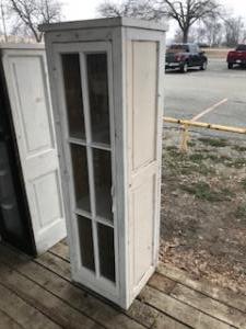 Primitive-style cabinet made from repurposed materials
