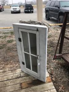 Primitive-style cabinet made from repurposed materials